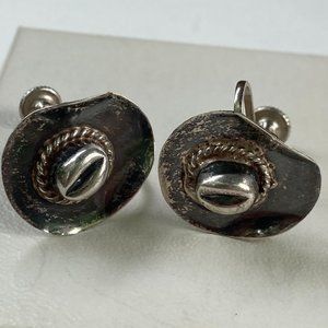 A pair of vintage sterling silver cowgirl hats with screw backs